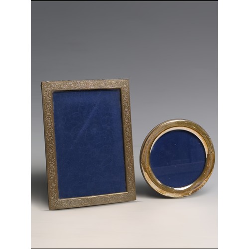 394 - Two Italian silver photo frames, including one polished circular frame and a rectangular photo with ... 