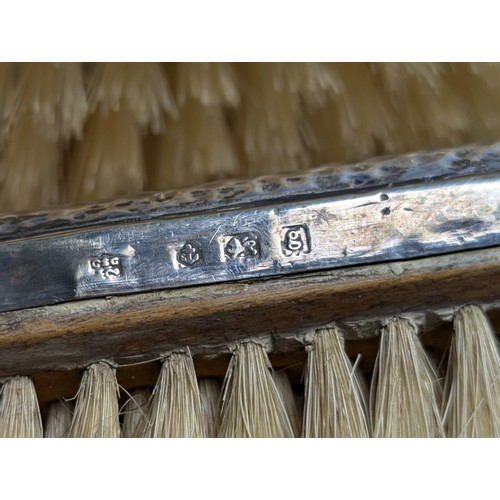 396 - Cased George V silver backed engine-turned pair of brushes and comb mount, Charles S Green & Co ... 