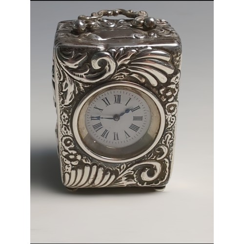 409 - Late Victorian silver cased travelling clock, Charles Henry Dumenil, London 1892, the case embo... 