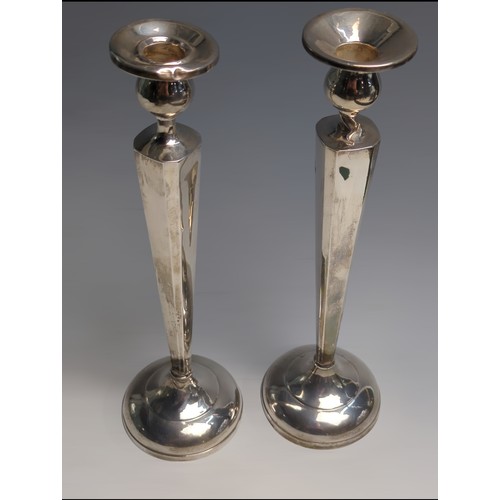 416 - Pair of silver candlesticks, marked to base 'Sterling Reinforced with Cement & Steel Rod 81... 