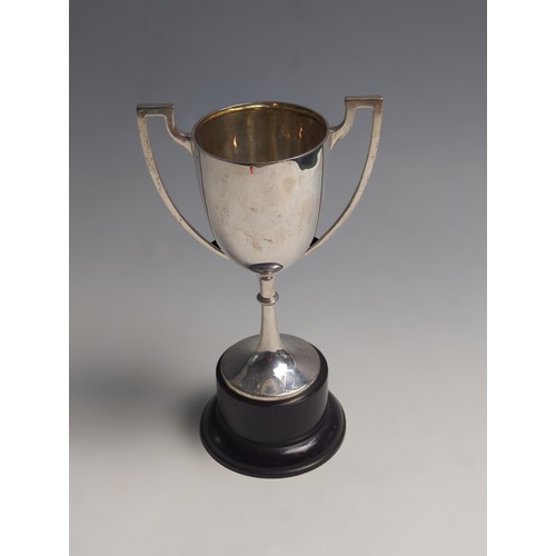 421 - Silver twin-handled trophy cup, unengraved, stamped 'silver', cup height 18.8cm, 215 grams, together... 