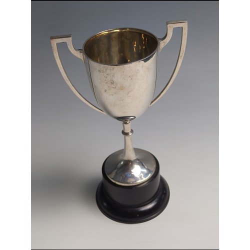 421 - Silver twin-handled trophy cup, unengraved, stamped 'silver', cup height 18.8cm, 215 grams, together... 