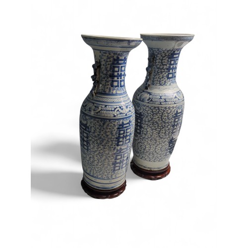 434 - A matched pair of large Chinese C19th porcelain blue and white 'Marriage' vases decorated with Doubl... 