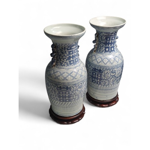 435 - A matched pair of Chinese C19th porcelain blue and white 'Marriage' vases decorated with Double Happ... 