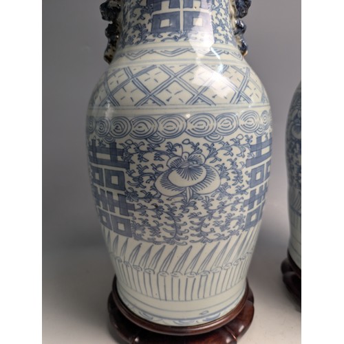 435 - A matched pair of Chinese C19th porcelain blue and white 'Marriage' vases decorated with Double Happ... 