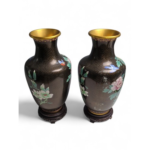 438 - Pair of C20th Chinese cloisonné vases decorated with peonies, butterflies and birds on a black groun... 