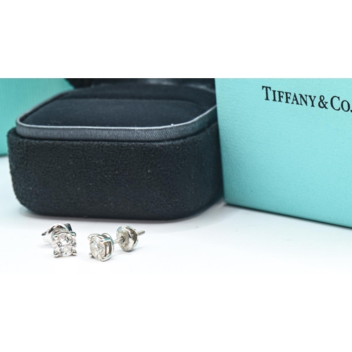 247 - Tiffany & Co. pair of diamond ear studs, each round brilliant-cut diamond weighing 0.56 carat, c... 