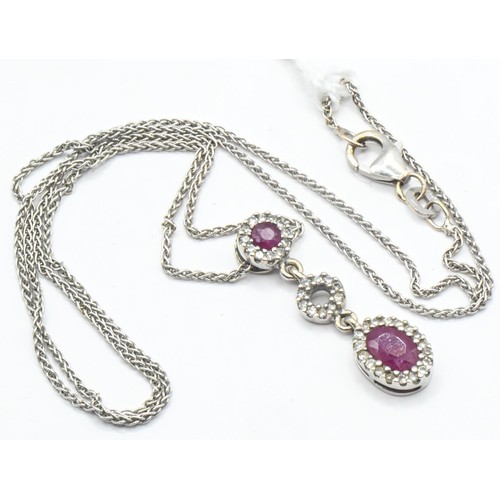 252 - 14ct white gold, ruby and diamond triple cluster pendant and chain, each marked 585, length 435mm, g... 