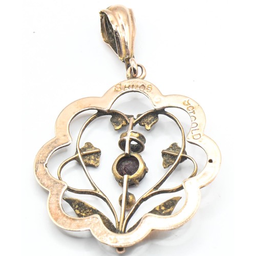 257 - 9ct gold, garnet and seed pearl open work floral design pendant, stamped 9CT GOLD and maker's mark, ... 