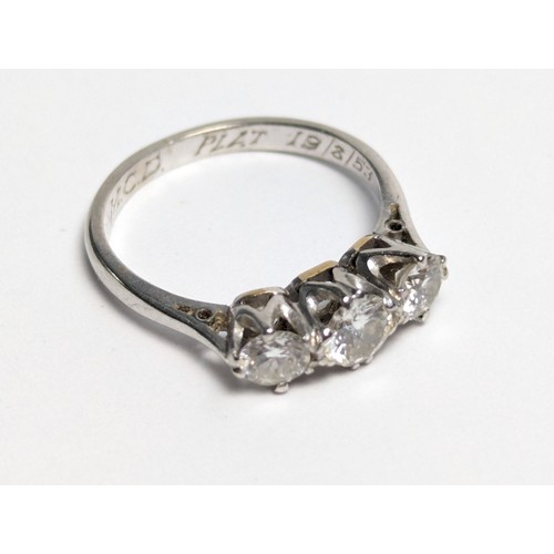 265 - Platinum and three stone diamond ring, personal dated inscription to inside band, marked PLAT, size ... 