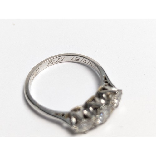 265 - Platinum and three stone diamond ring, personal dated inscription to inside band, marked PLAT, size ... 