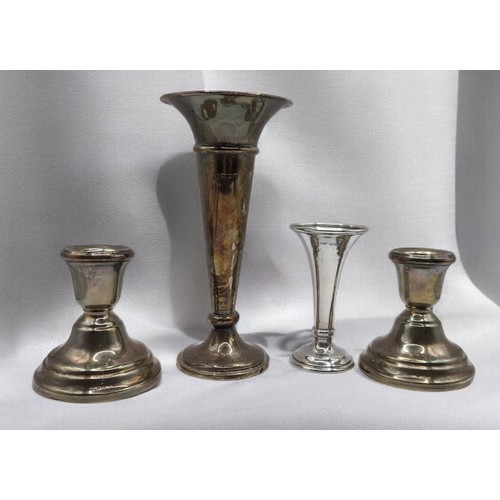 413 - Pair of silver candlesticks and two trumpet vases, various makers and dates, weighted, tallest vase ... 