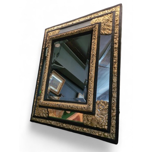 433 - French Repousse Brass and Ebonised Cushion mirror 72cm by 85cm