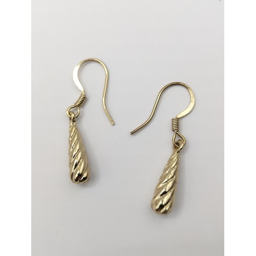 251A - Pair of yellow metal twist drop earrings, gross weight 3 grams