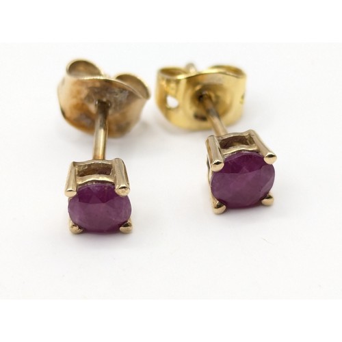 171A - Pair of ruby stud earrings. gross weight 0.83 grams