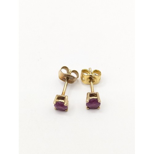 171A - Pair of ruby stud earrings. gross weight 0.83 grams