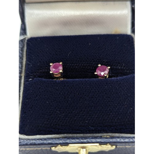 171A - Pair of ruby stud earrings. gross weight 0.83 grams