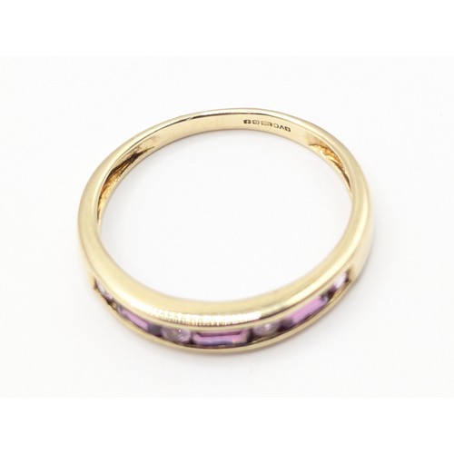 173A - Half eternity 'stacker' ring channel set with tourmaline and pink sapphire. Size P. Gross weight 1.7... 