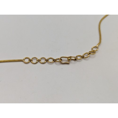 75 - Yellow metal and diamond necklace, the front designed as a line of three rows of brilliant-cut diamo... 