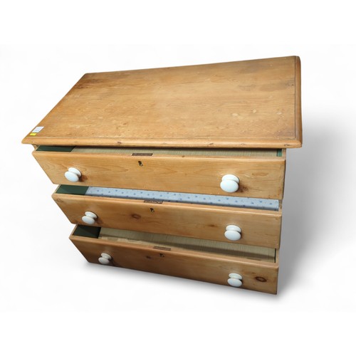 3 - Strip pine 3 drawer chest of drawers with white ceramic knobs. Locks to each drawer but no keys. On ... 