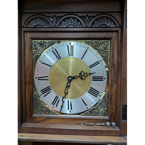 14 - Oak long cased clock 46cm by 29cm by 201cm