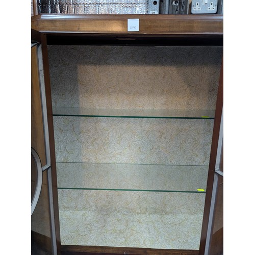 24 - Mahogany glass-fronted display cabinet with 2 glass shelves. Key present. W109cm D31cm H120cm.