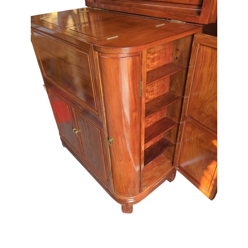 25 - Rosewood cocktail cabinet with various storage drawers and cupboards for a variety of glasses/bottle... 