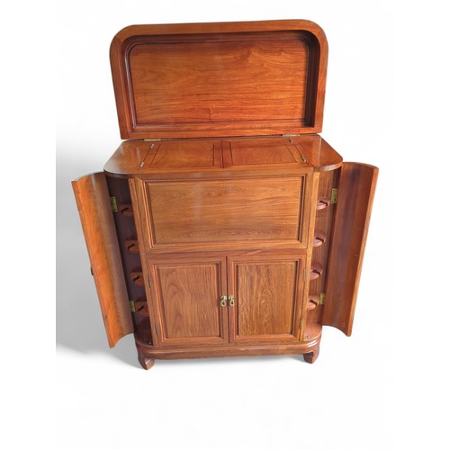 25 - Rosewood cocktail cabinet with various storage drawers and cupboards for a variety of glasses/bottle... 