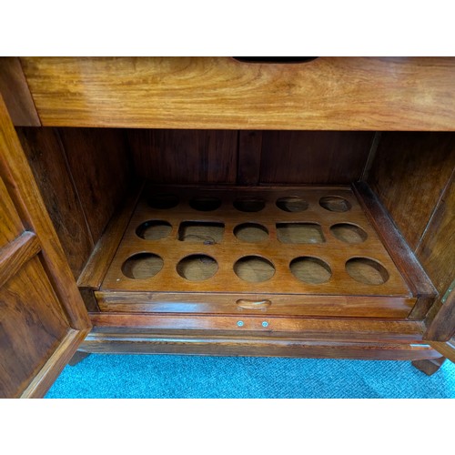 25 - Rosewood cocktail cabinet with various storage drawers and cupboards for a variety of glasses/bottle... 