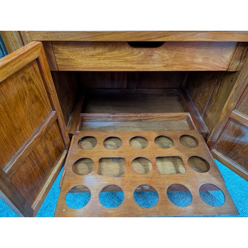 25 - Rosewood cocktail cabinet with various storage drawers and cupboards for a variety of glasses/bottle... 