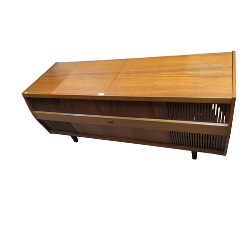 36 - Mid-century teak cased HMV Solid State Stereogram, with Garrard 3000 turntable 143cm by 48cm by 60 c... 