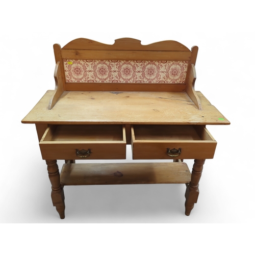 38 - Pine wash stand. With tiled back and 2 draws 99cm by 43cm by 104cm 