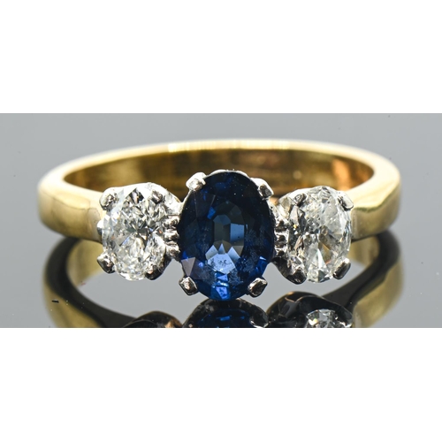 18ct gold, sapphire and diamond three stone ring, London hallmark, size N, gross weight 4.92 grams