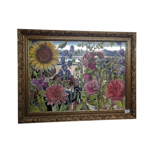 562 - Gilt framed mirror with applied floral decoration to glass 82 x 62cm