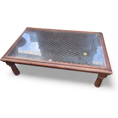 408 - Large coffee table with glass top and metal lattice underneath. W137cm D85cm H40cm.