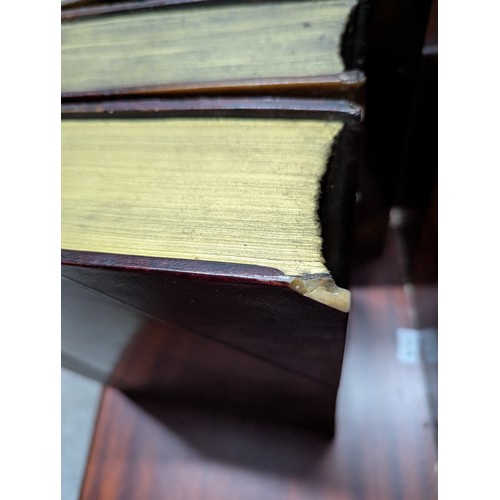 668 - Three large decorative faux books, W30 x L39 x D9cm each