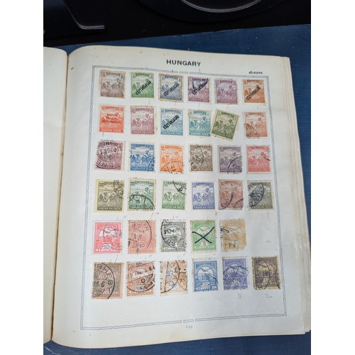 671 - Part filled album of used world stamps