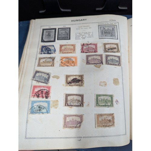 671 - Part filled album of used world stamps