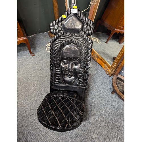 732 - Darkwood African birthing chair in two parts with carved design to front, L84cm W29cm.