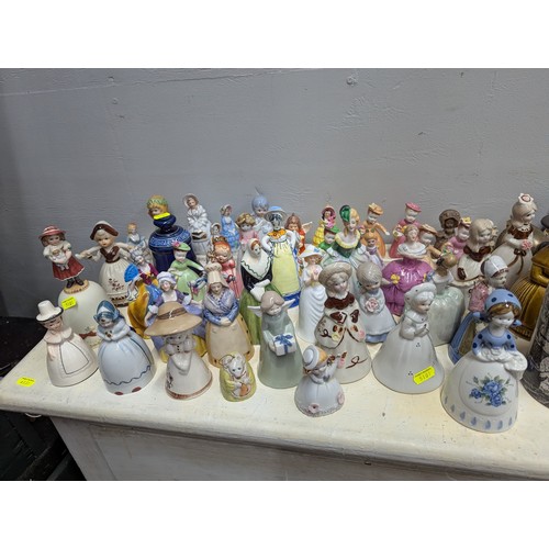 778 - Large quantity ceramic & some glass table bells, together with various ceramics, silver plated w... 