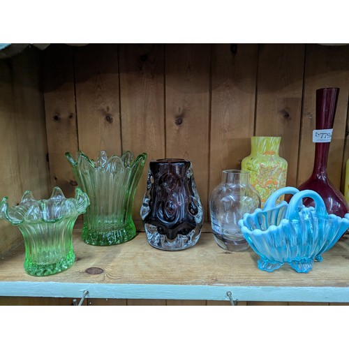 779 - Assorted coloured glass on shelf