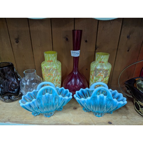 779 - Assorted coloured glass on shelf