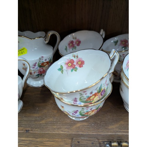 792 - Crescent tea service for eight with two cream jugs, six side plates and a cake plate