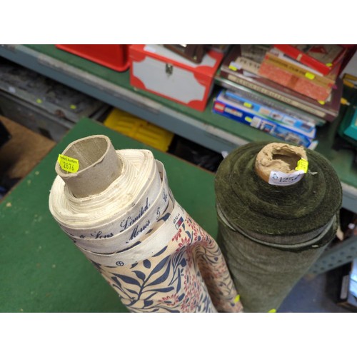 125 - 2 rolls of fabric (unknown lengths). 