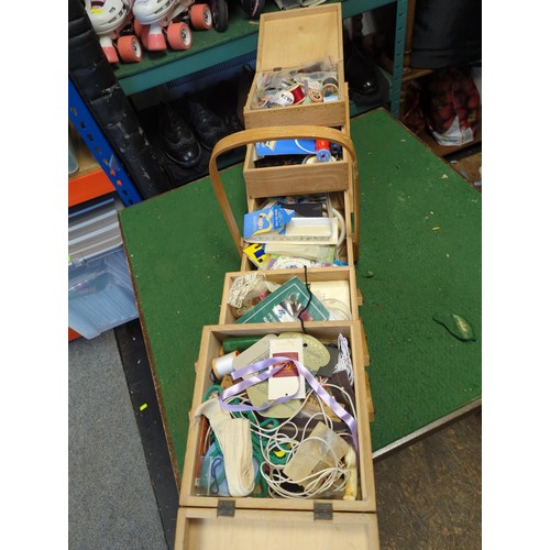 139 - Concertina sewing box with contents inc. threads, spools, buttons etc. 