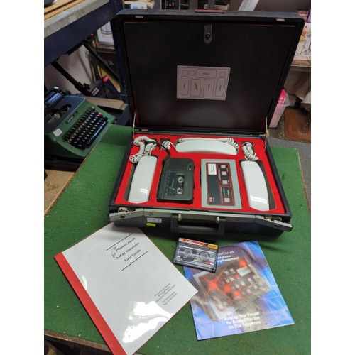 91 - PhoneCoach 3-Way Simulator training equipment in hard case with instructions.