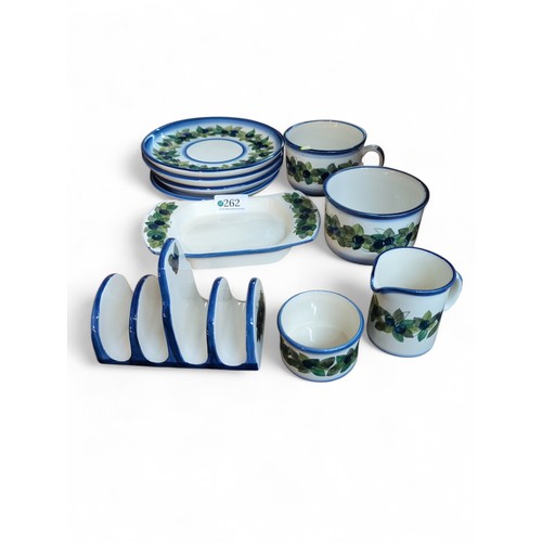 176 - Jersey Pottery inc. 2 plates, 2 saucers, 2 cups, butter dish, sugar bowl, toast rack, milk jug.