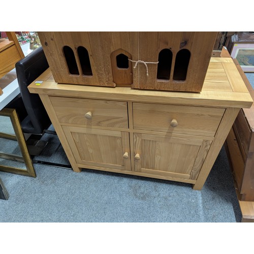 827 - Oak sideboard with two drawers over two doors, width 110cm, depth 46cm, height 85cm