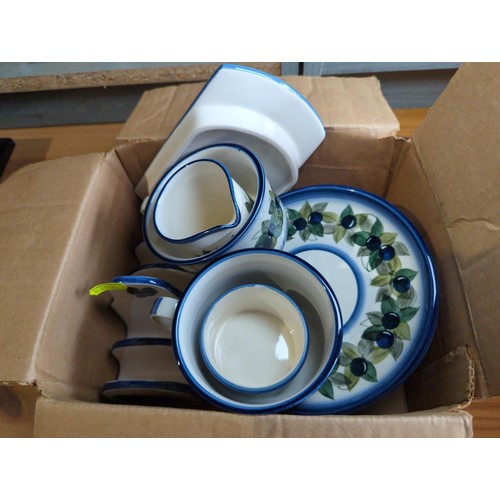 176 - Jersey Pottery inc. 2 plates, 2 saucers, 2 cups, butter dish, sugar bowl, toast rack, milk jug.