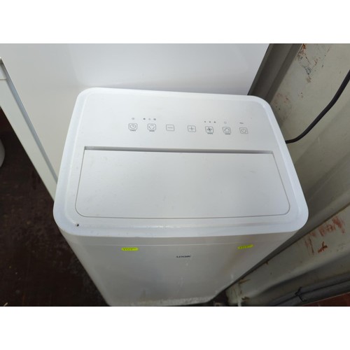 273 - Logik model LAC12C24 aircon + dehumidifier. Vendor confirms full working order with remote and acces... 